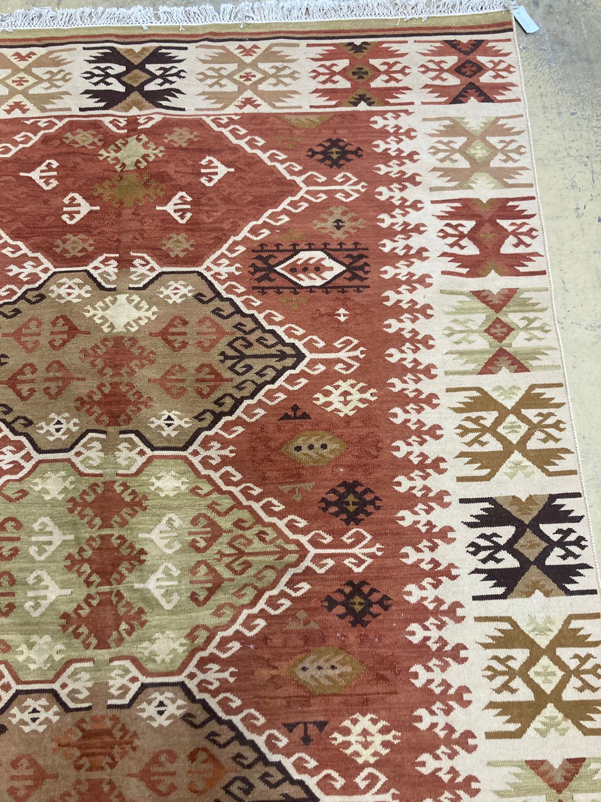 A geometric Kilim rug, 240 x 167cm